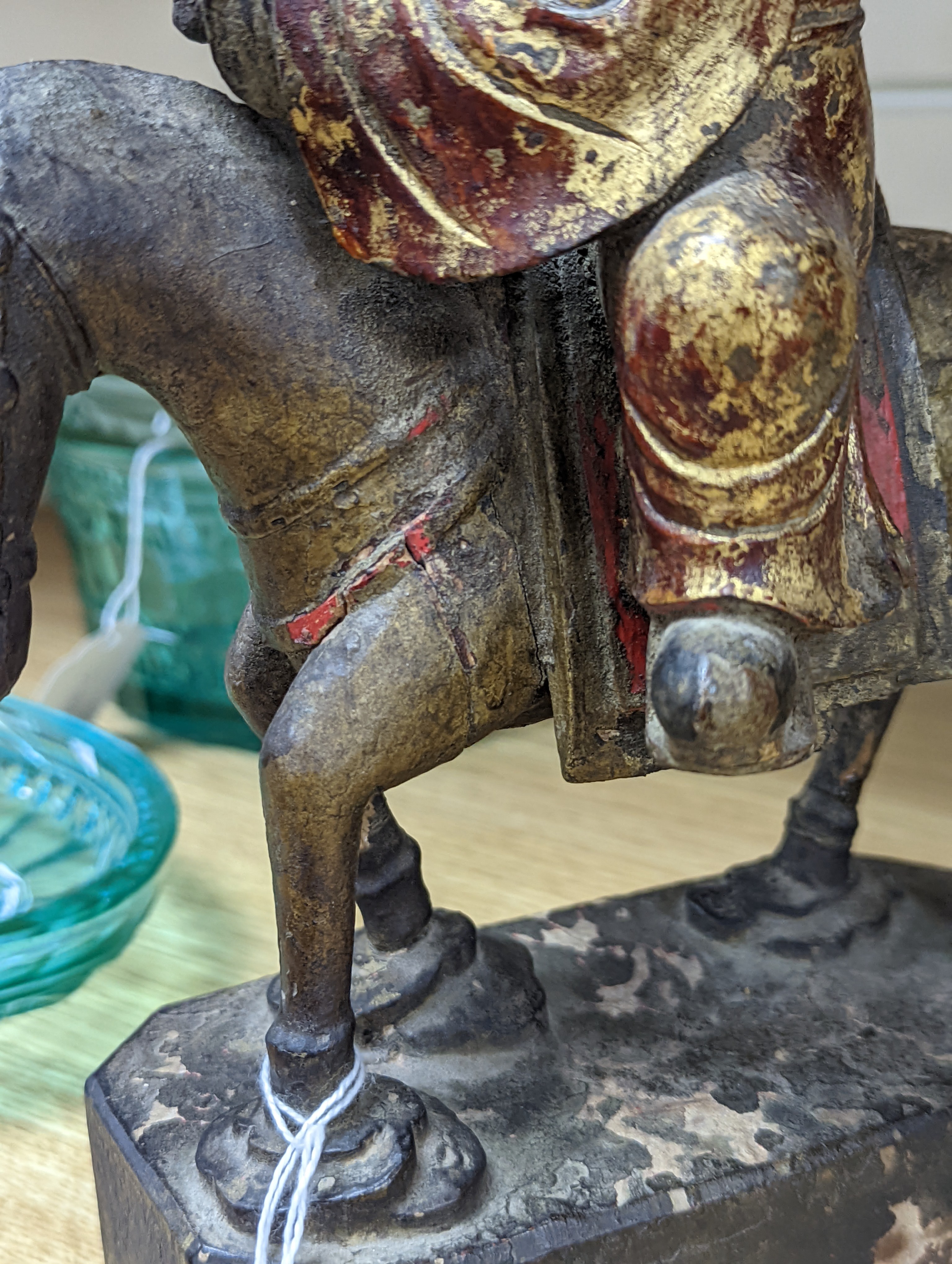 An 18th/19th century Chinese lacquered wood group of an official riding a horse, 30cm